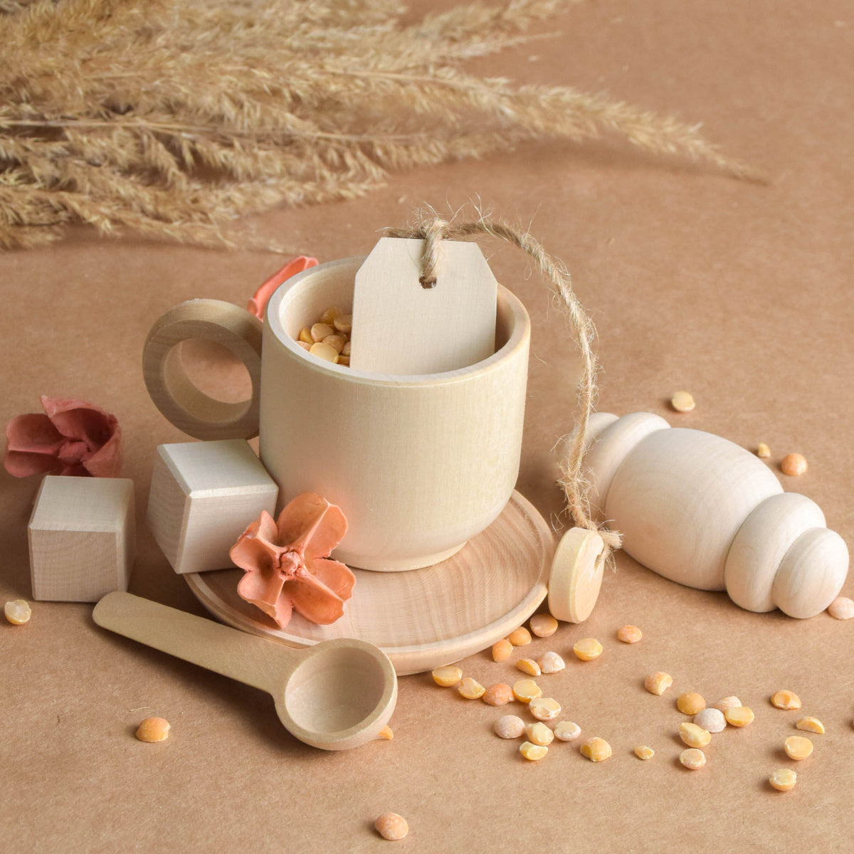 Handmade wooden tea party accessories for Montessori-inspired play, crafted from natural solid wood