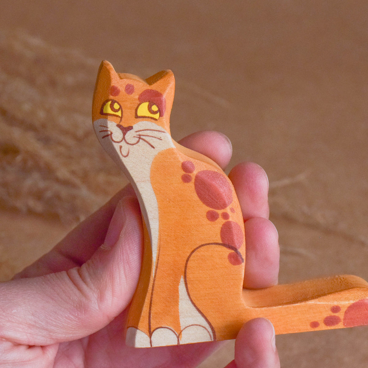 Wooden animal figurines of cats and kittens
