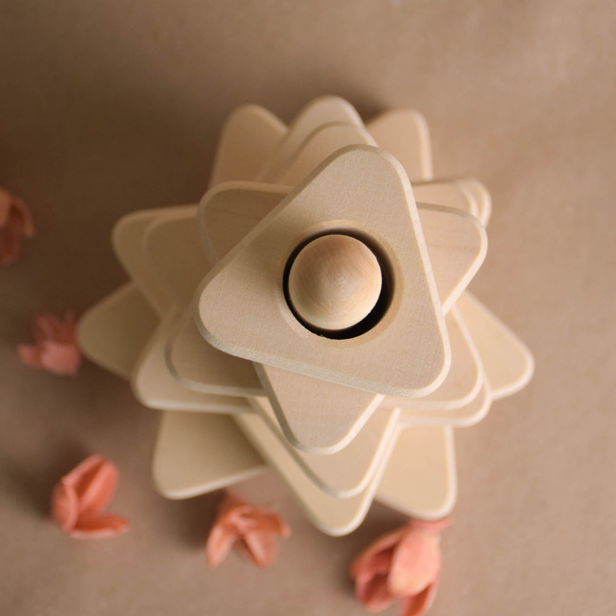 Natural wood stacking toy with triangular rings