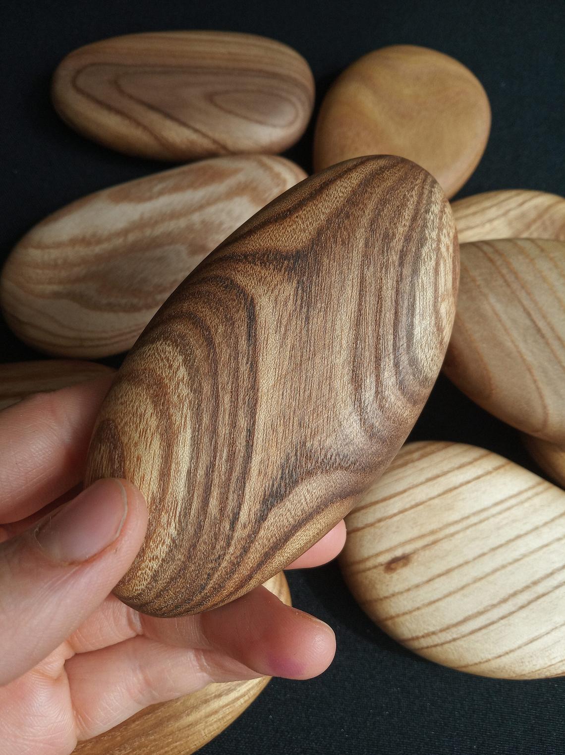 Pebble-shaped stacking blocks made from catalpa wood