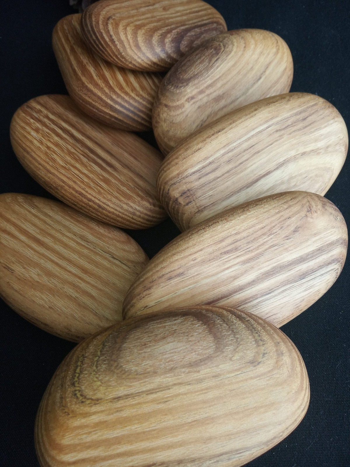 Green acacia wood pebbles for stacking and balancing