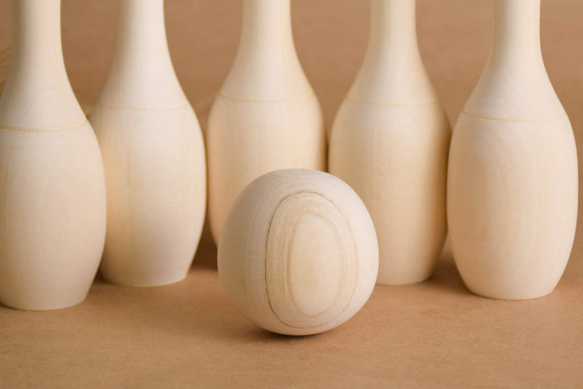 Mini bowling game with wooden pins
