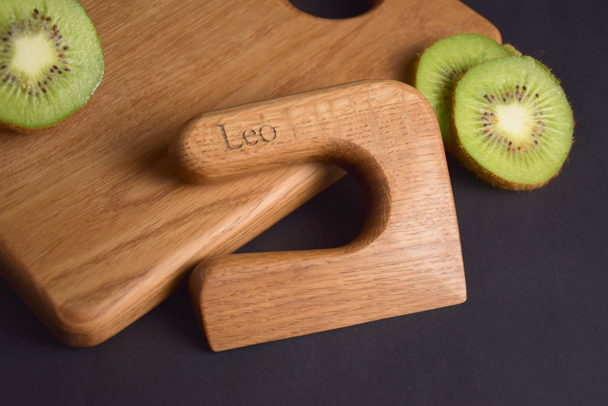 Handmade Montessori knife and cutting board set in solid oak wood with a natural oil finish