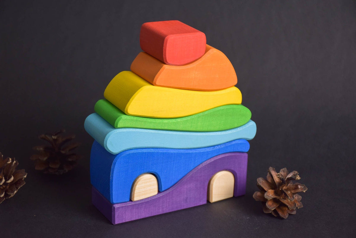 Handmade Montessori house-shaped nesting toy in linden wood with a natural colored wax finish