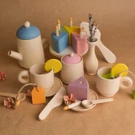 Tea Set and Pastel Cake with Candles