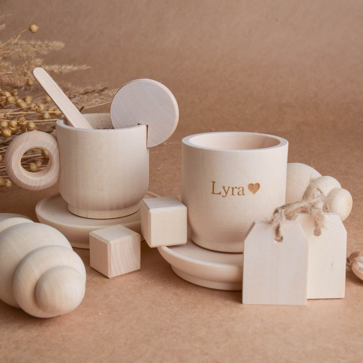 Handmade wooden tea party accessories for Montessori-inspired play, crafted from natural solid wood