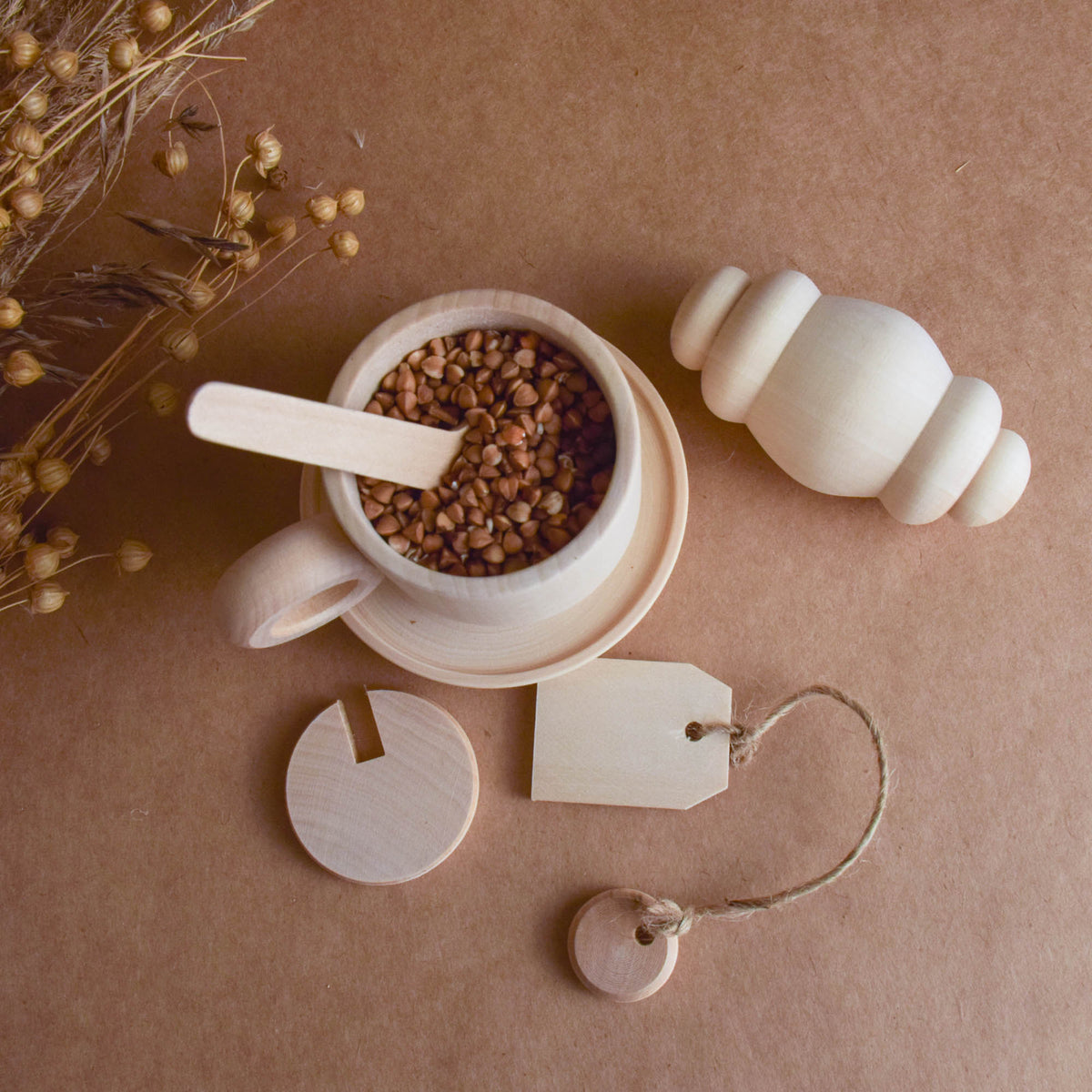 Handmade wooden tea party accessories for Montessori-inspired play, crafted from natural solid wood