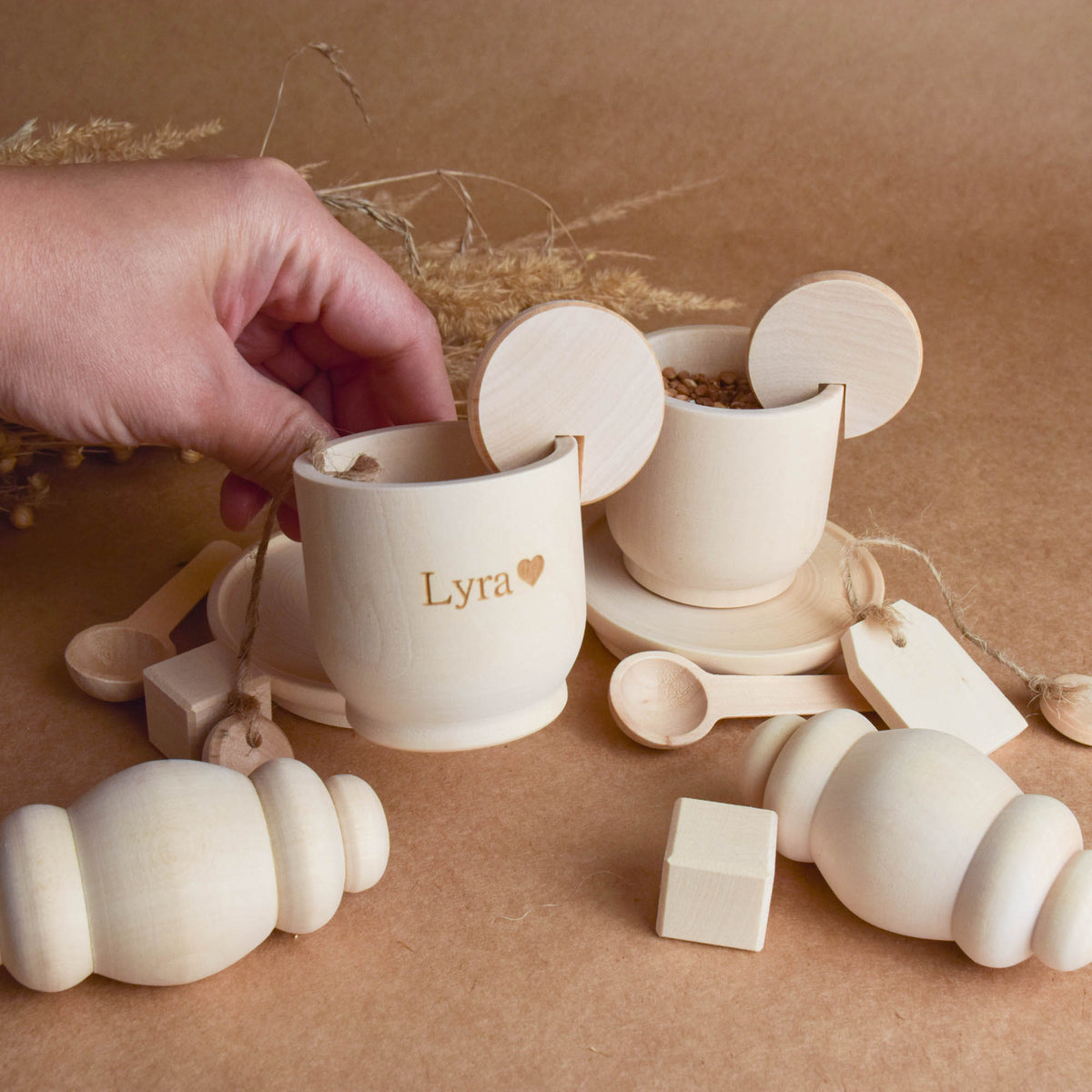 Handmade wooden tea party accessories for Montessori-inspired play, crafted from natural solid wood