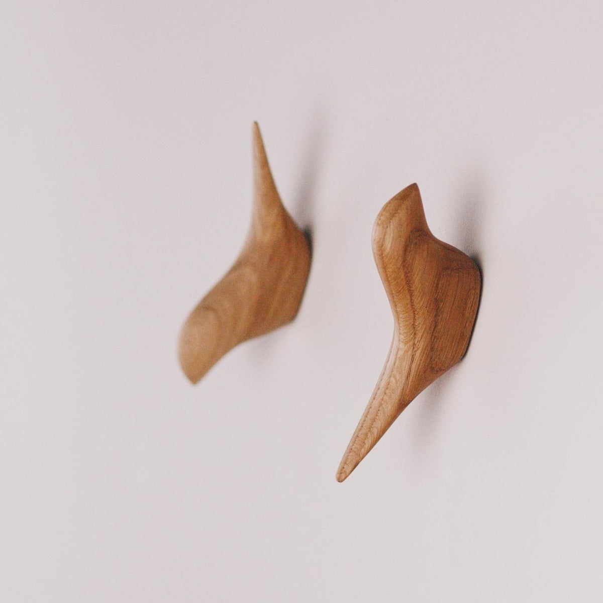 Handmade bird-shaped wooden hooks for home decor