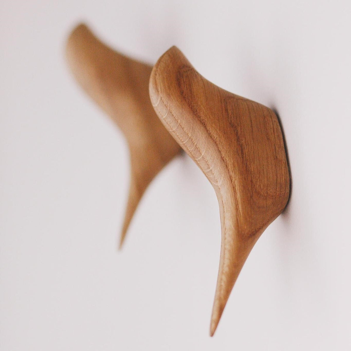 Bird-shaped adhesive wall hooks made from wood