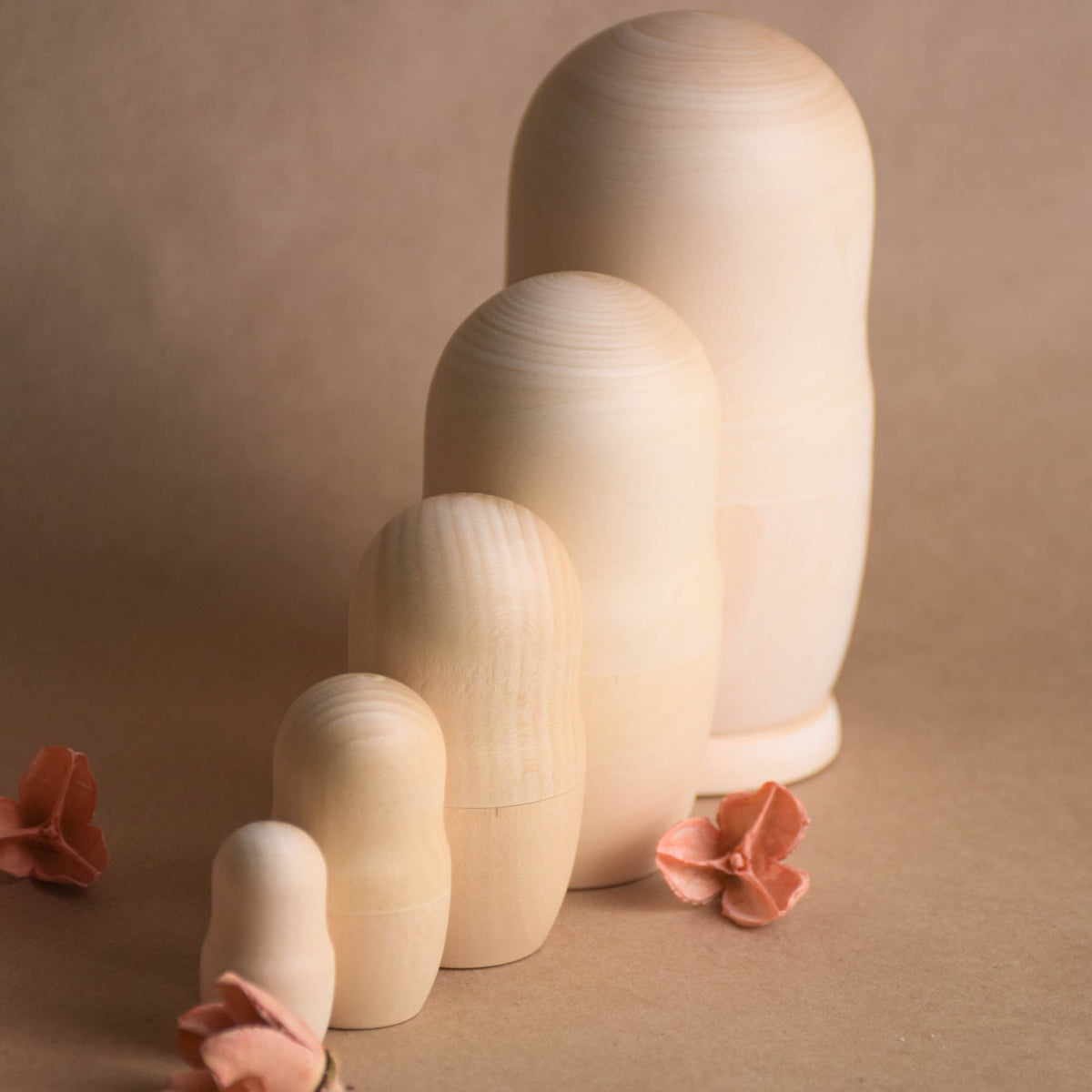 Natural wood matryoshka dolls in graduated sizes