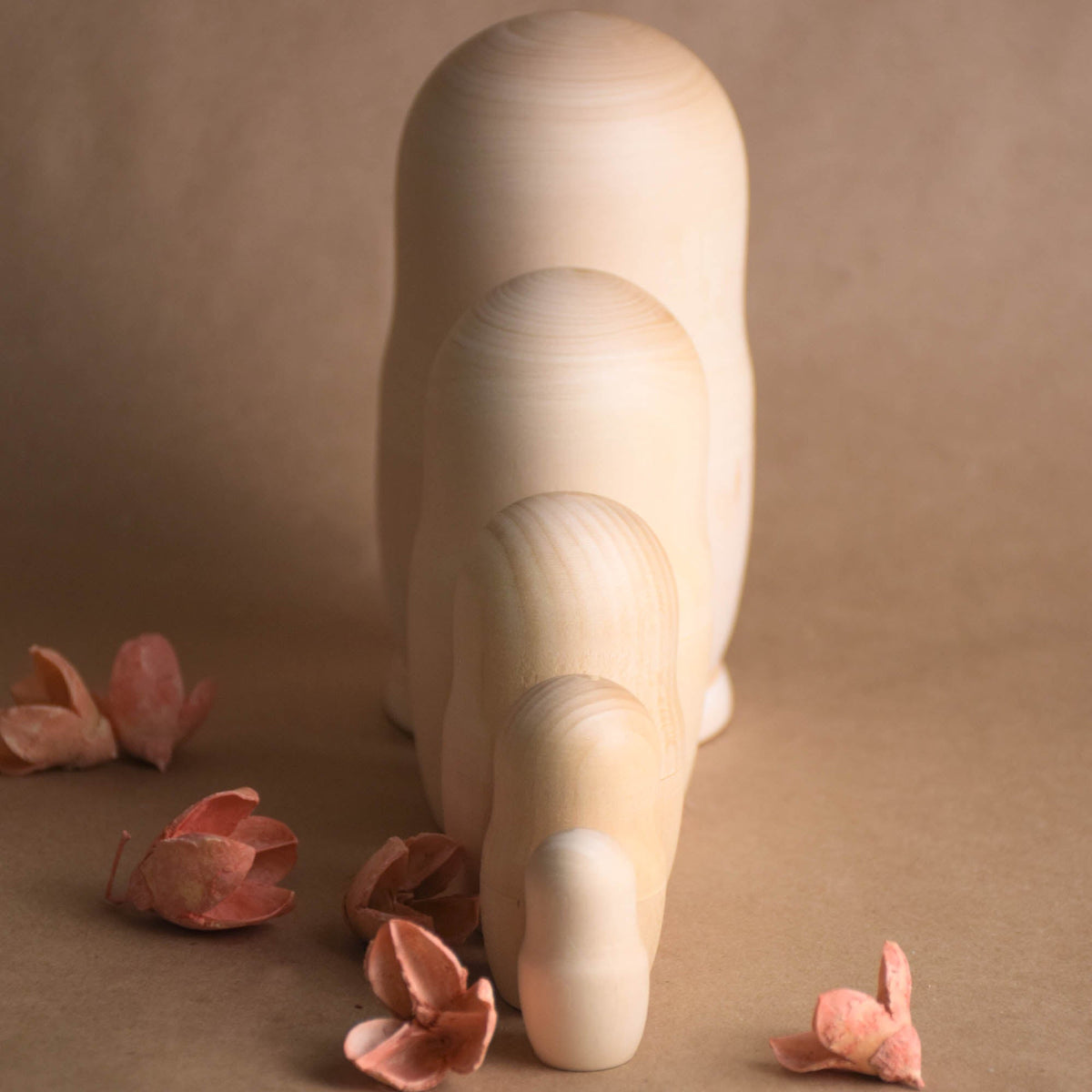 Undecorated matryoshka dolls made from solid wood