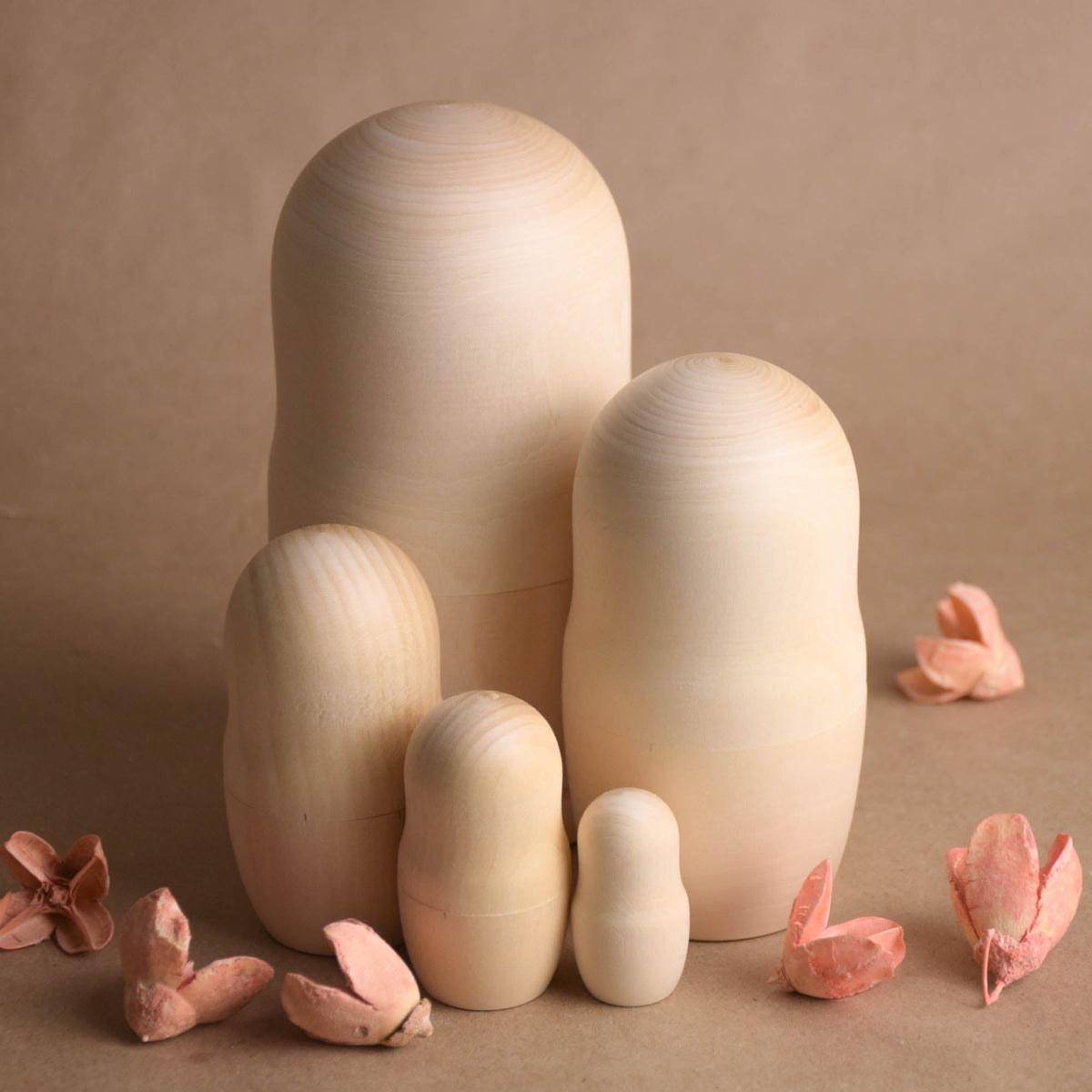 Blank wooden nesting dolls with undecorated surfaces