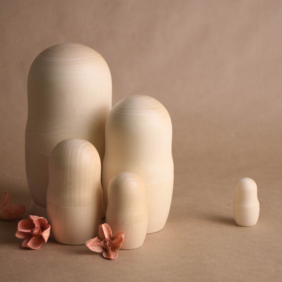 Wooden matryoshka figures without painted details
