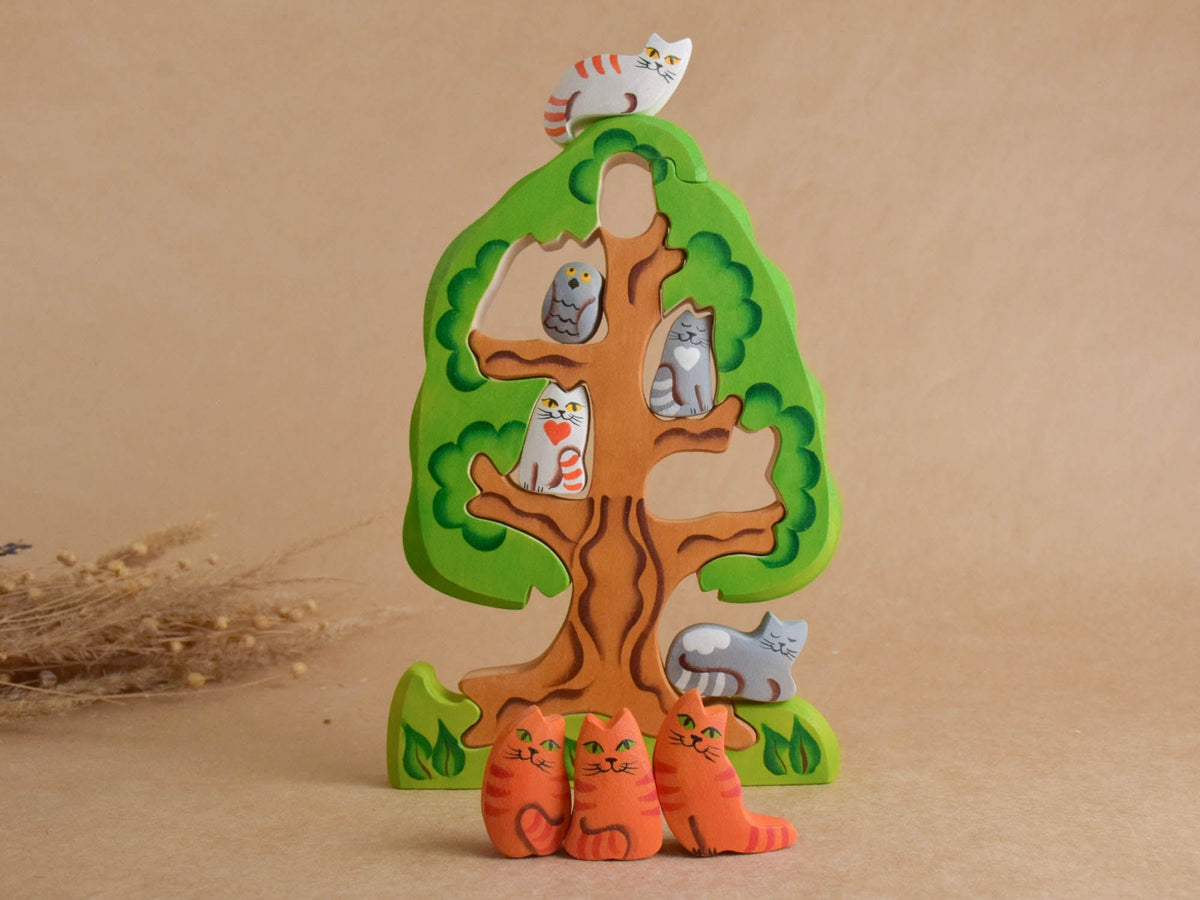 Wooden puzzle featuring cats and a tree