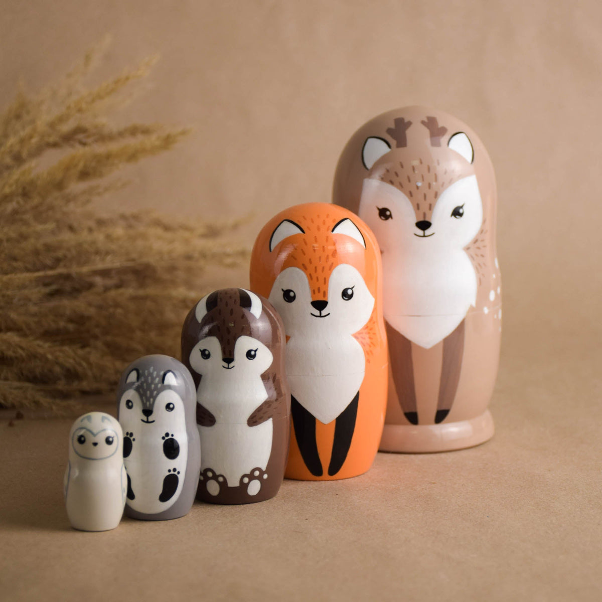 Woodland animal matryoshka dolls with a neutral palette
