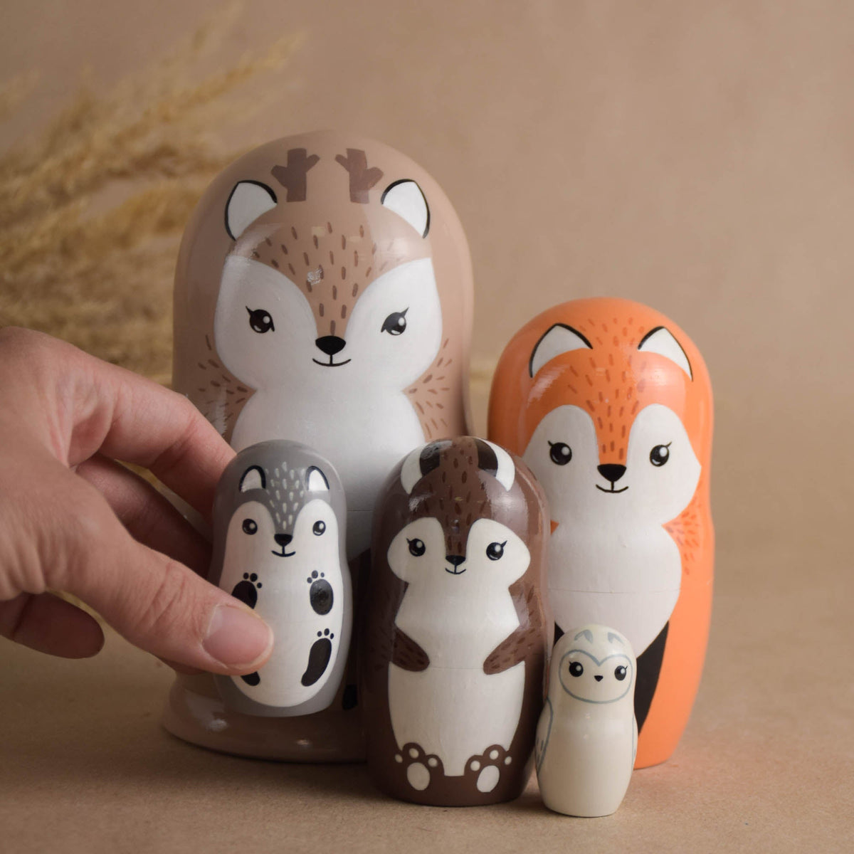 Wooden matryoshka dolls with woodland animal designs