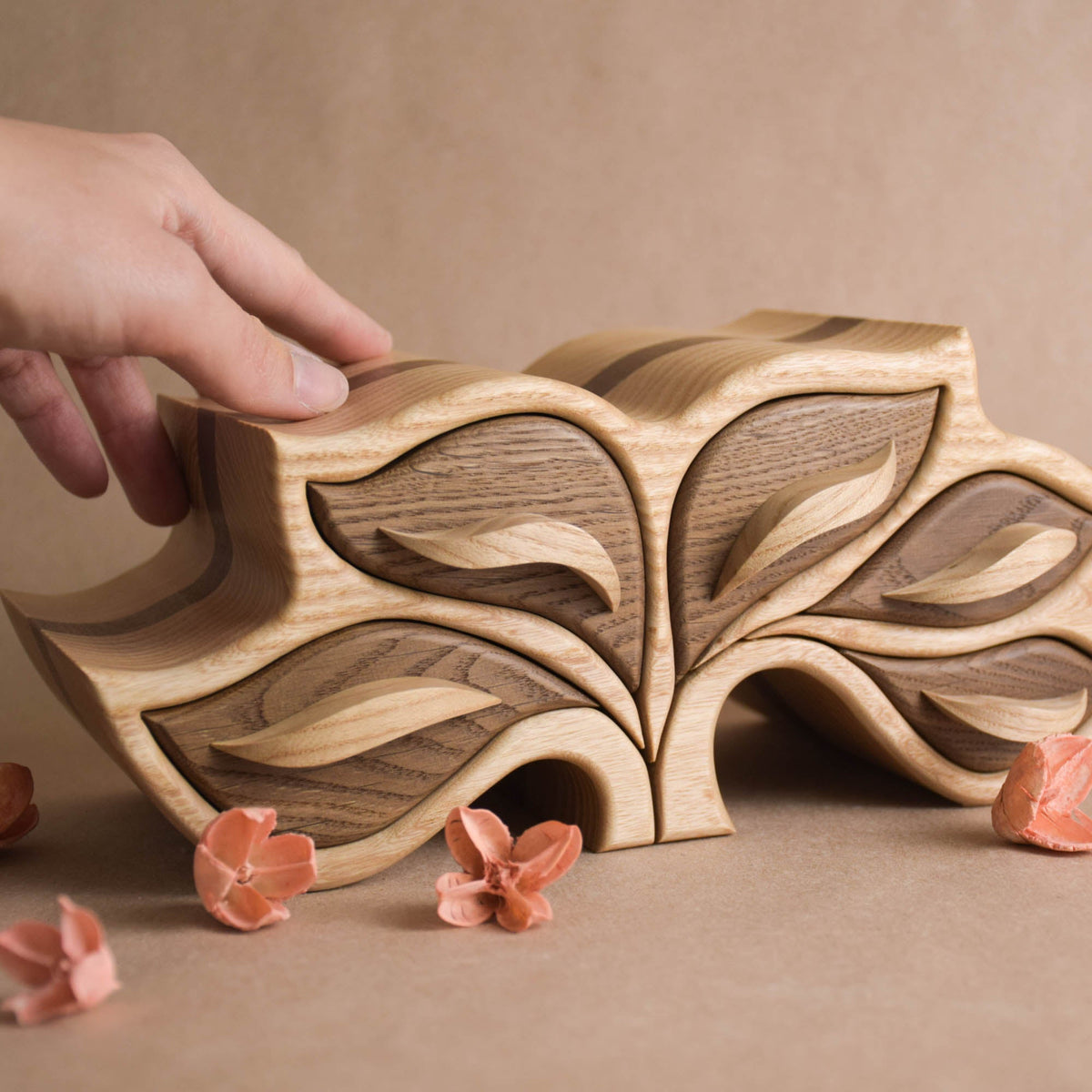 Tree-inspired wooden jewelry box with leaf-shaped drawers