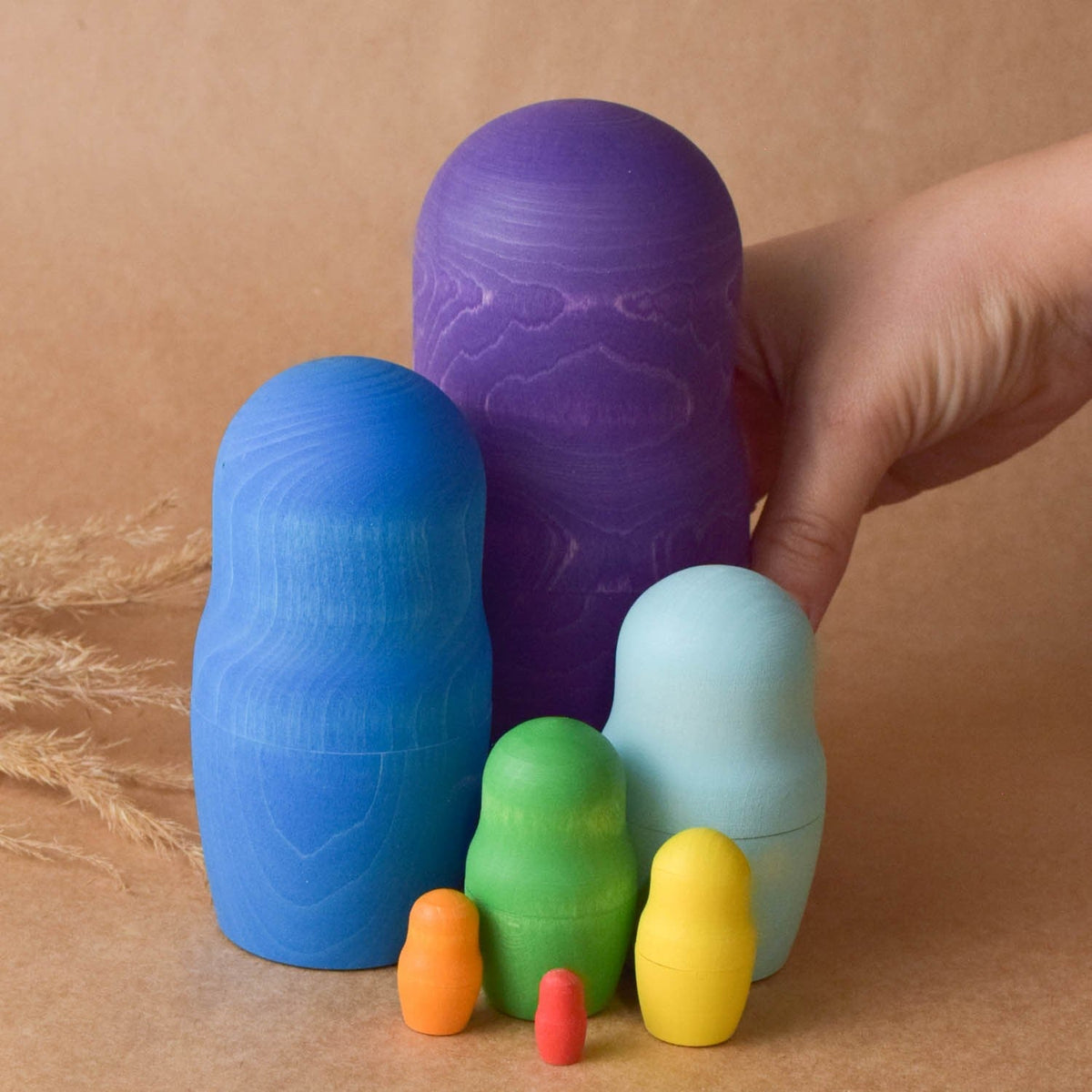 Colorful matryoshka dolls made from natural wood