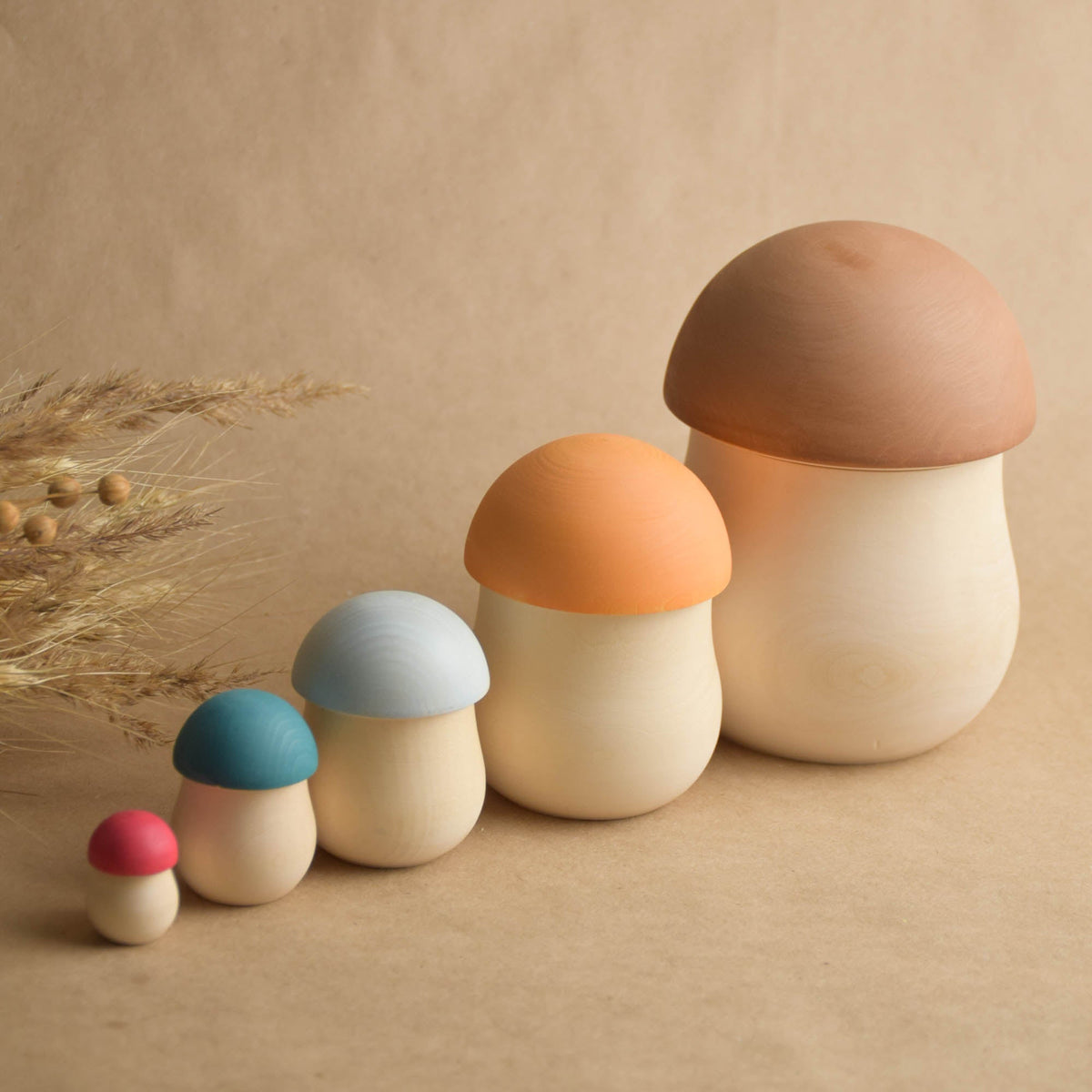 Colorful wooden mushroom nesting dolls
