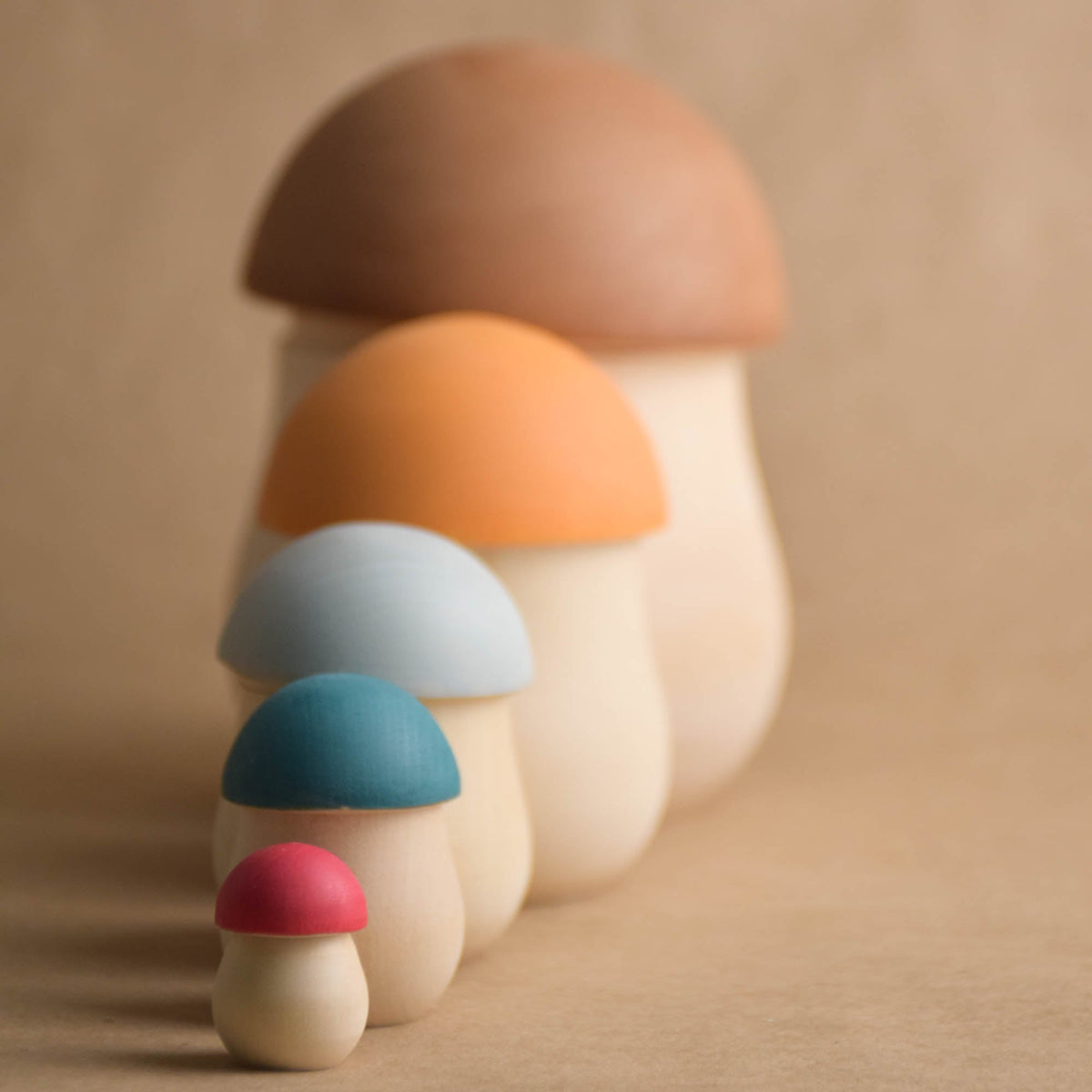 Colorful mushroom matryoshka figures in graduated sizes