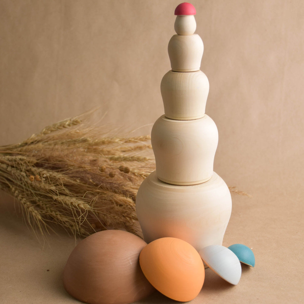 Wooden nesting mushrooms with colorful decoration
