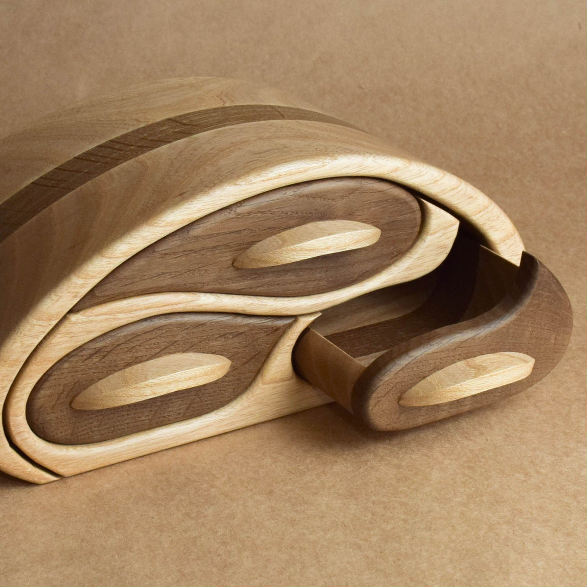 Oval wooden jewelry organizer with compartments