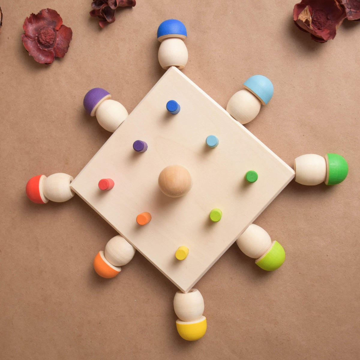 Mushroom sorting toy with a wooden geoboard base