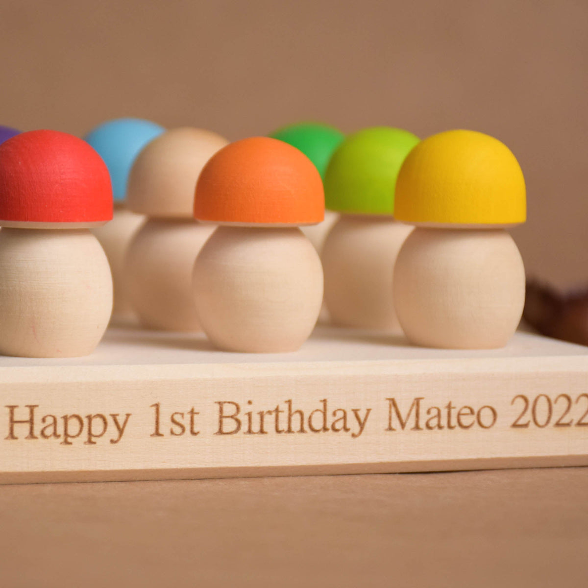 Colored wooden mushrooms with a geoboard sorting base