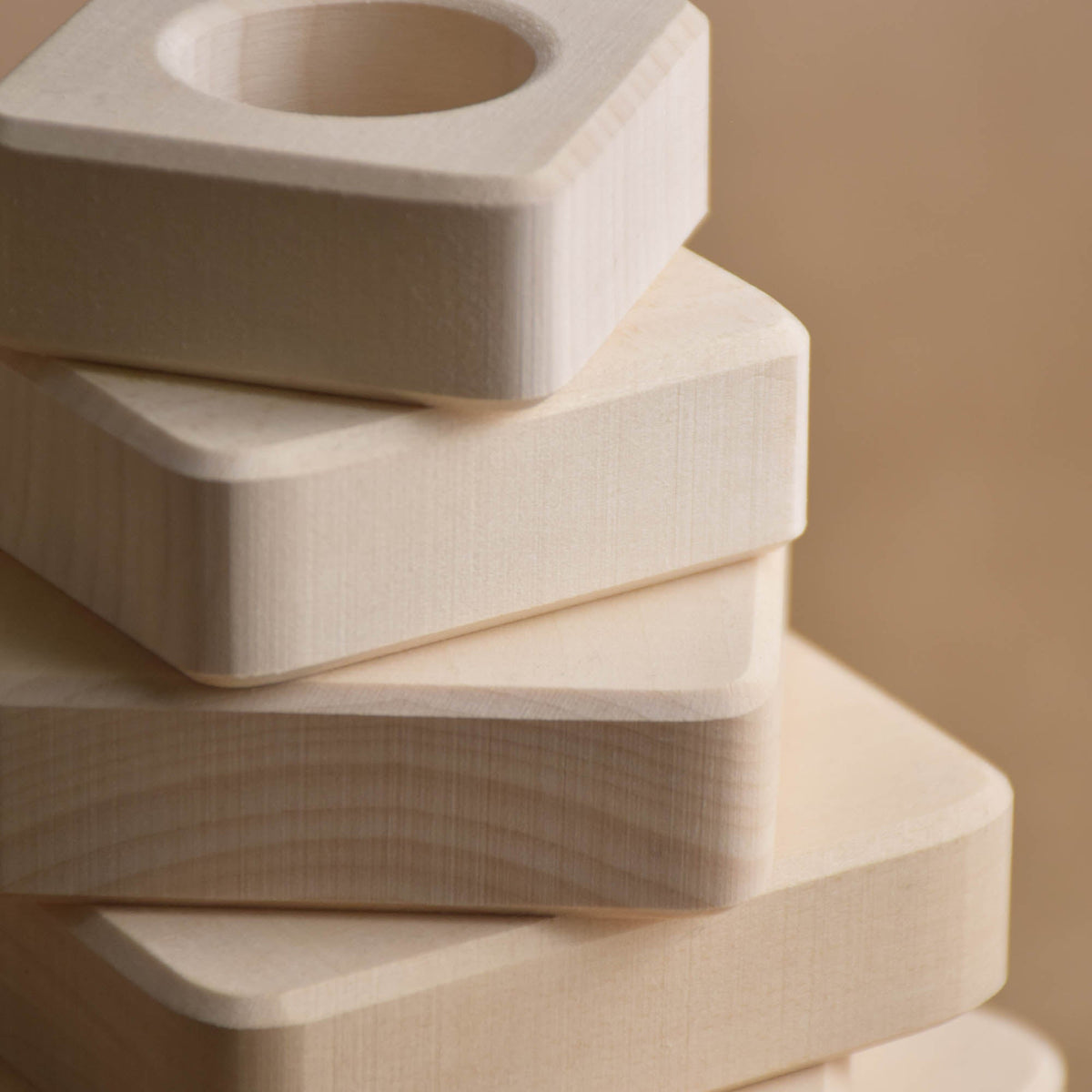 Natural wood stacking toy with square rings