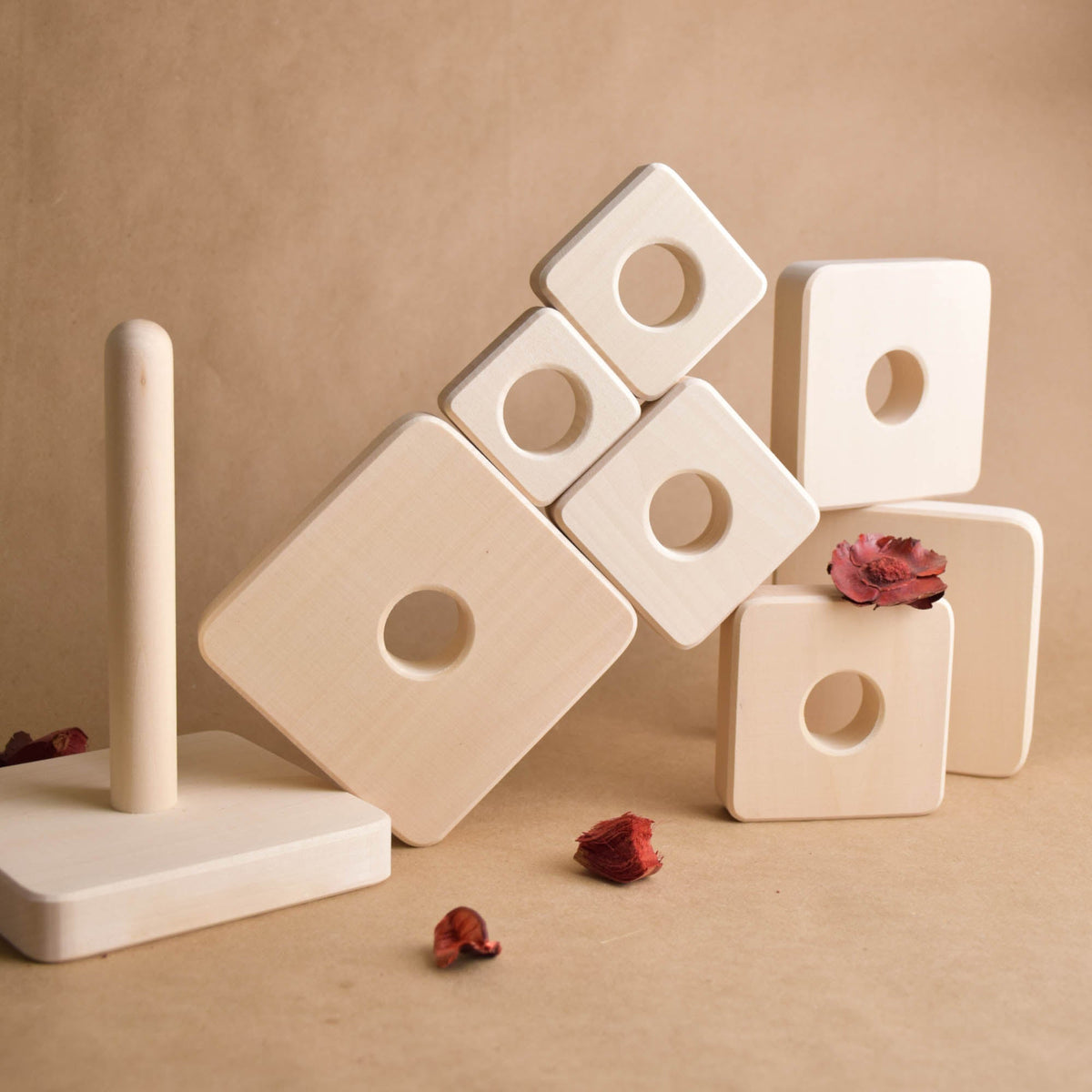 Ring stacking toy made from natural wood, with square rings