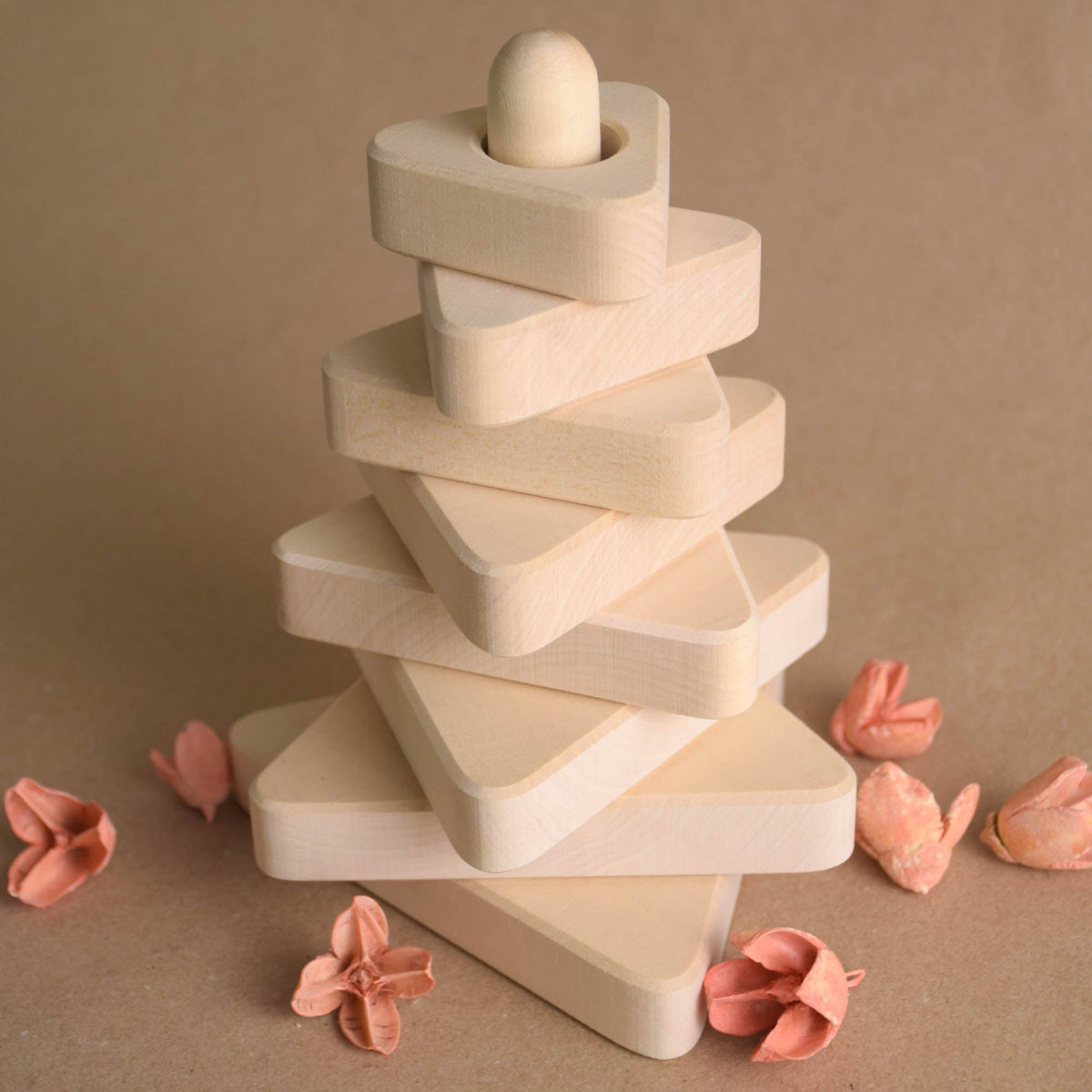 Natural wood stacking toy with triangular rings