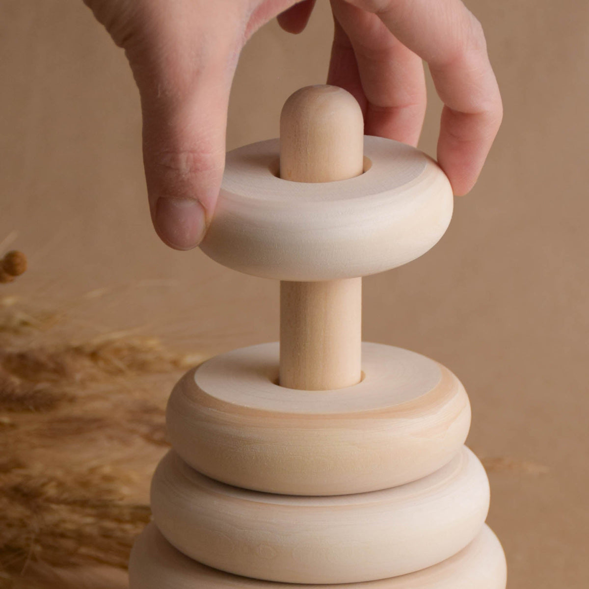 Natural wood stacking toy with turned rings