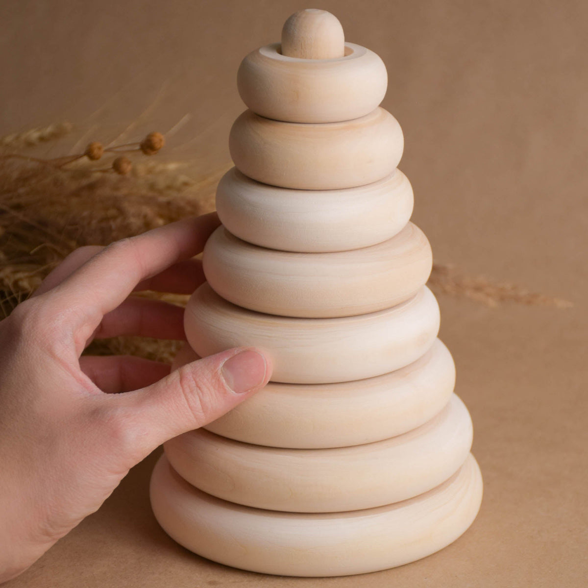 Natural wood stacking toy with turned rings