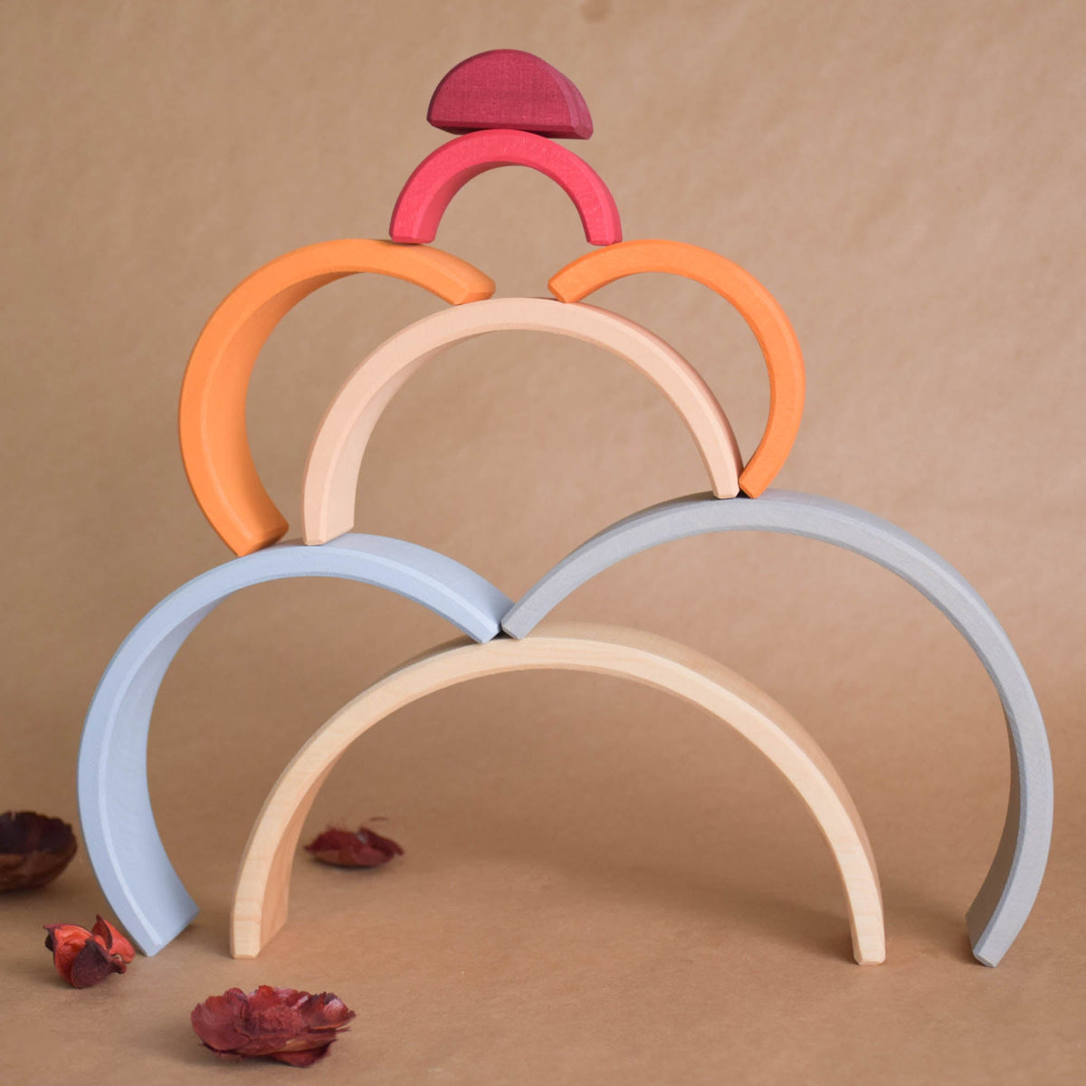 Handmade Montessori neutral rainbow stacker in linden wood with a natural wax-and-oil finish