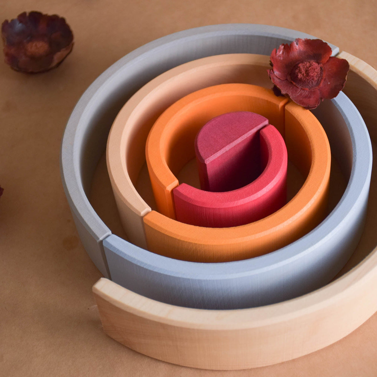 Handmade Montessori neutral rainbow stacker in linden wood with a natural wax-and-oil finish