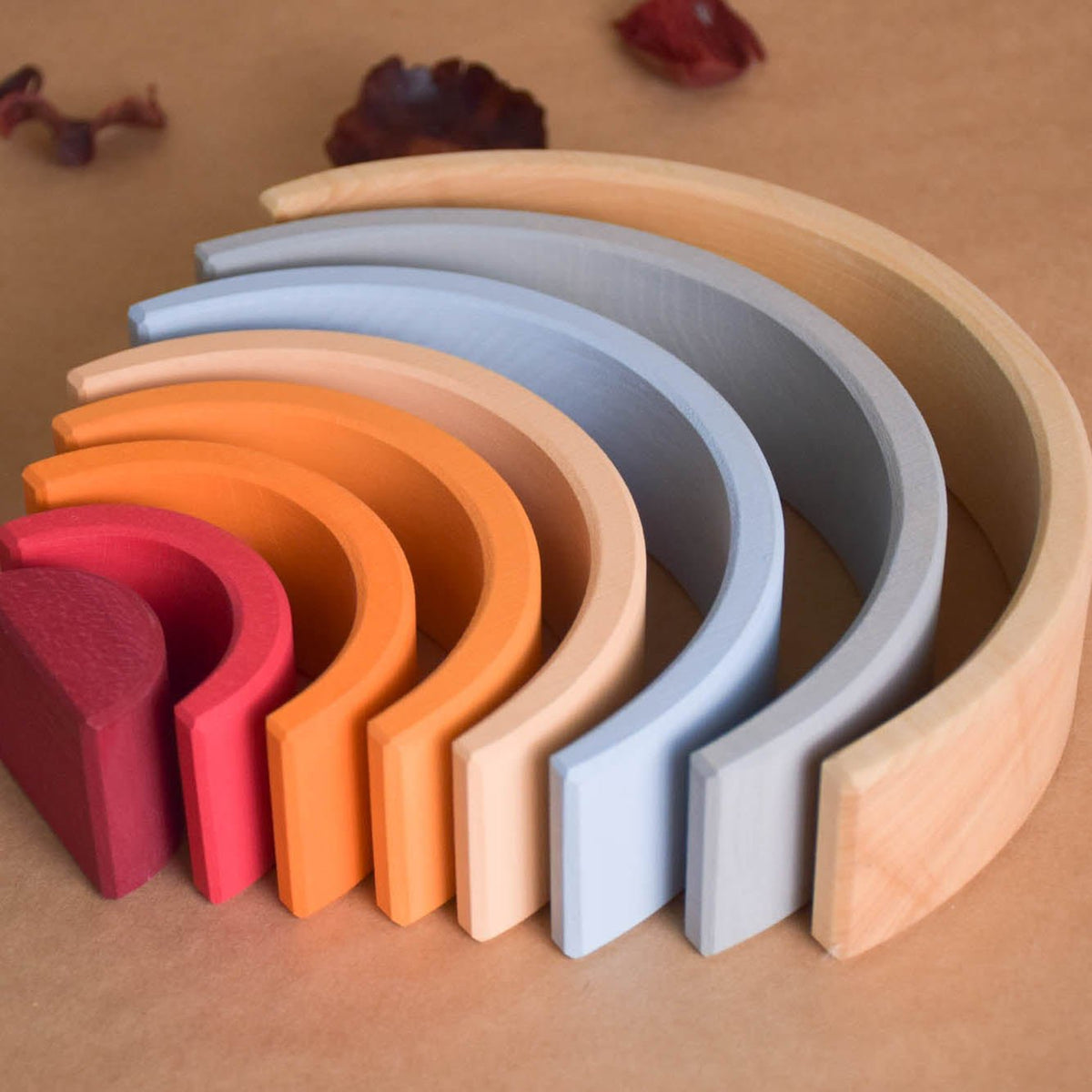 Handmade Montessori neutral rainbow stacker in linden wood with a natural wax-and-oil finish