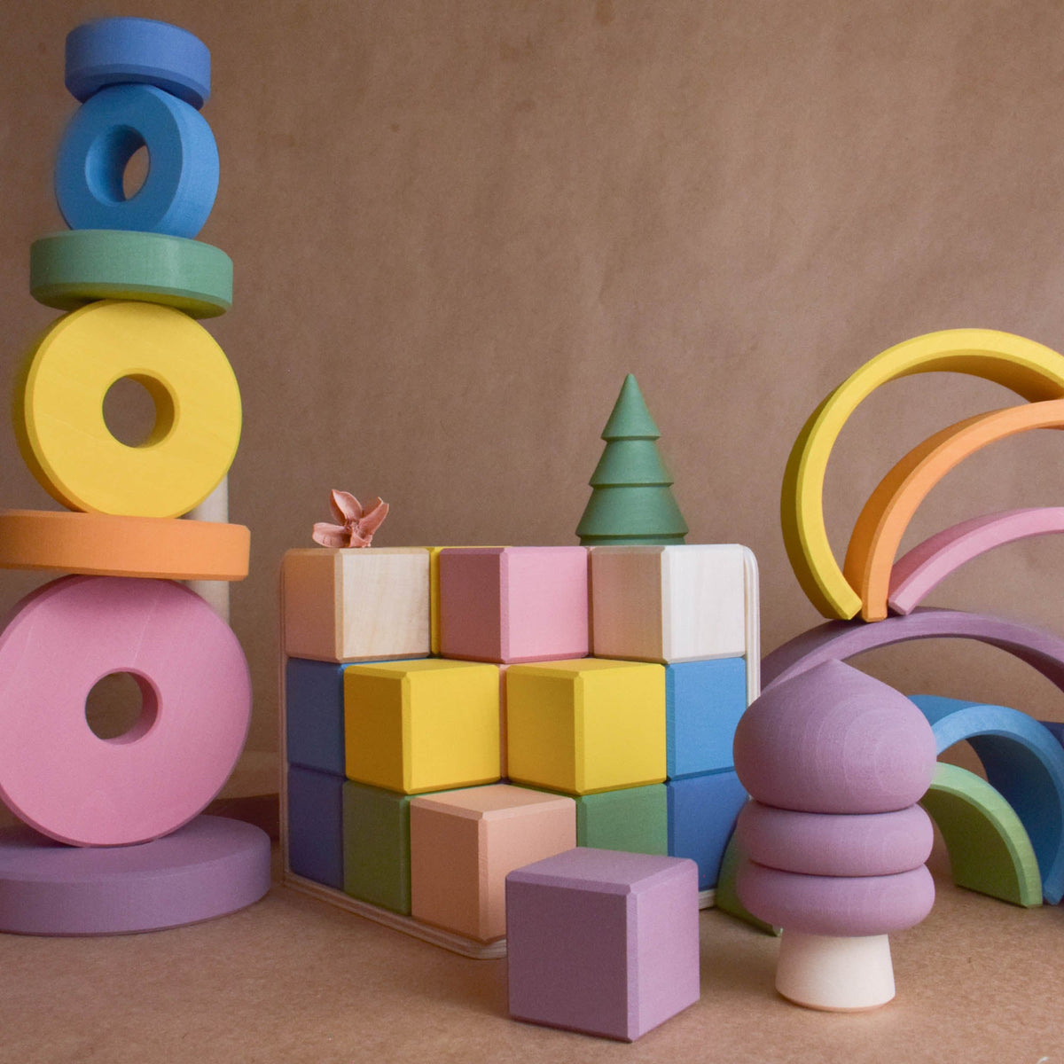Product photo of Pastel Cubes in Cube, a pastel-colored counting wooden wooden rainbow stacker set.