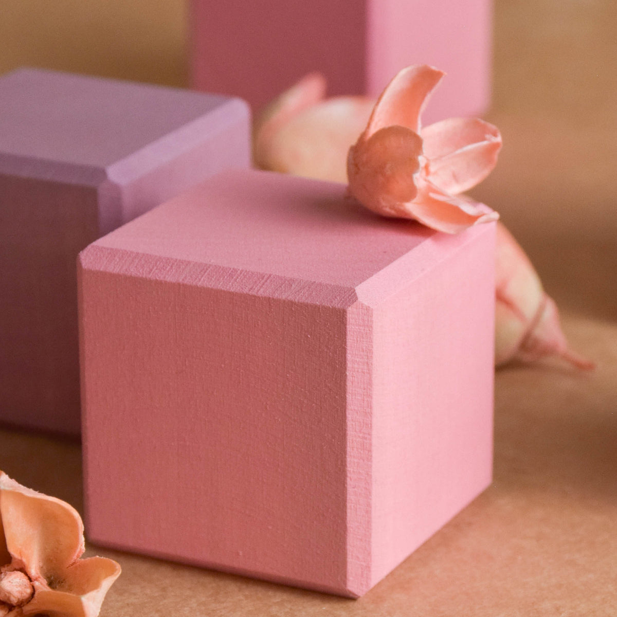 Wooden wooden rainbow stacker from the Pastel Cubes in Cube collection, shown in a product view.