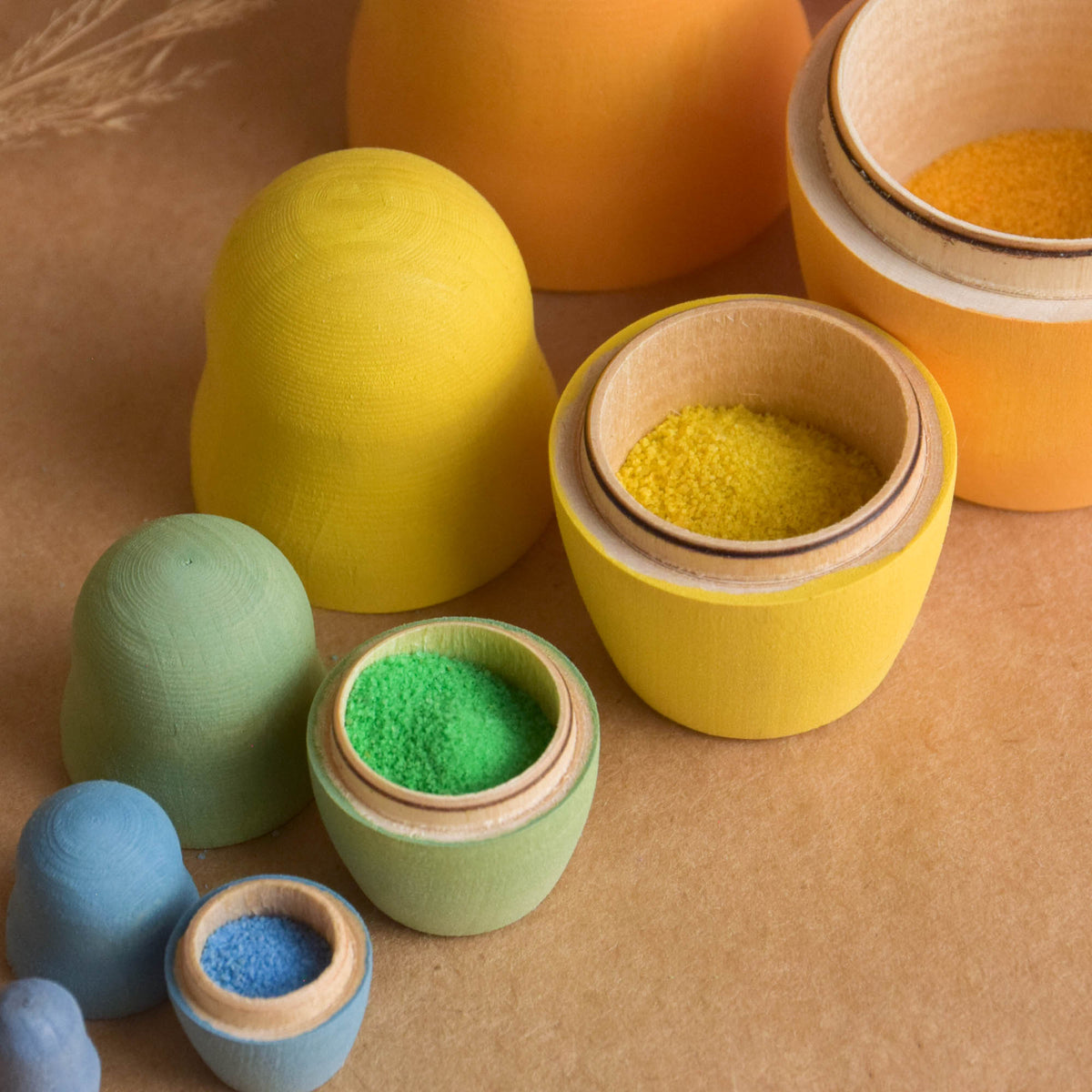 Pastel-colored wooden nesting dolls