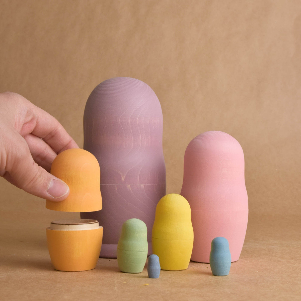 Pastel rainbow matryoshka dolls made from solid wood