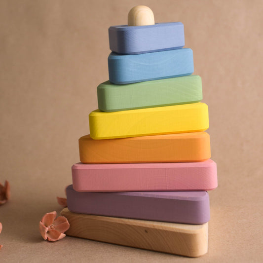 Wooden stacking toy with pastel-colored triangular rings