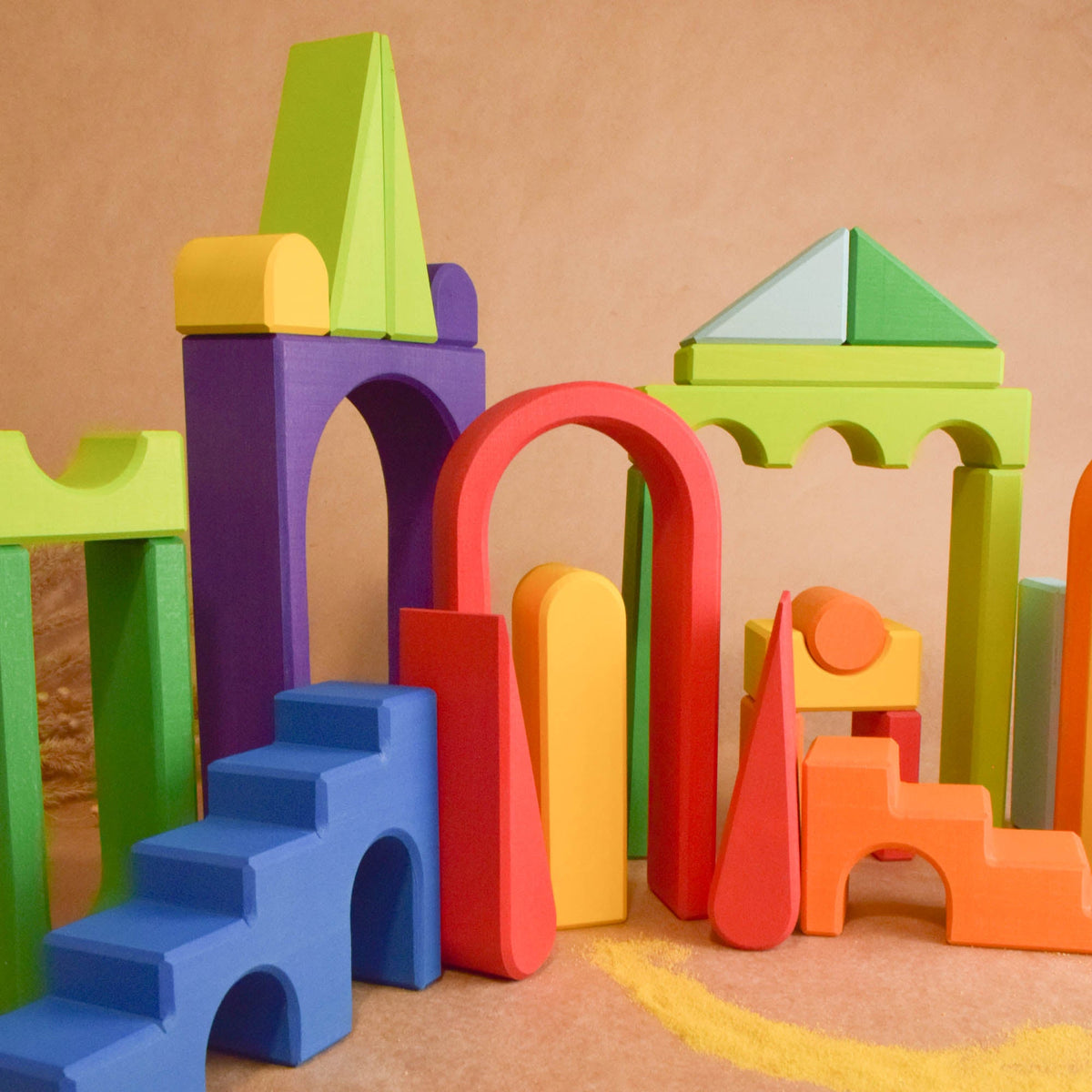 Product photo of Rainbow City Building Set, a colorful city-building wooden wooden rainbow stacker set.