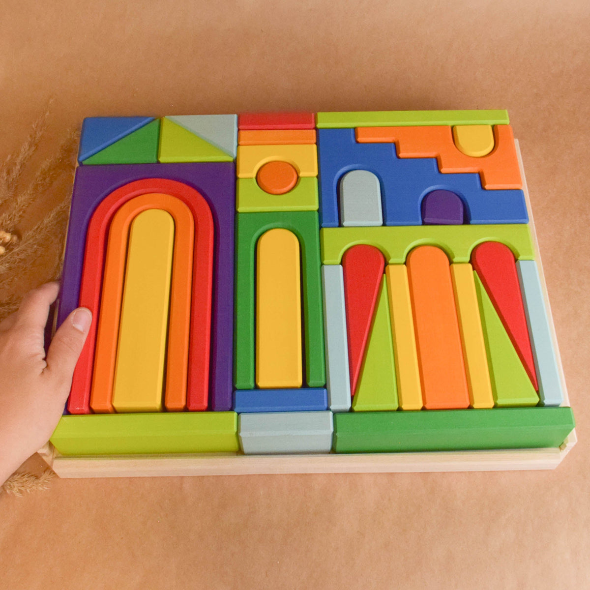 Rainbow City Building Set wooden toy shown for open-ended building and imaginative play.
