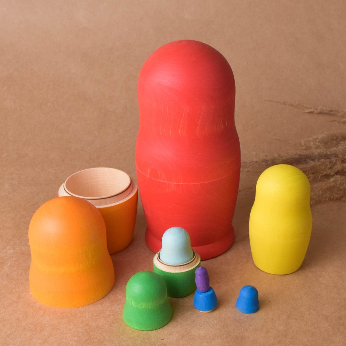 Colorful wooden nesting dolls in graduated sizes