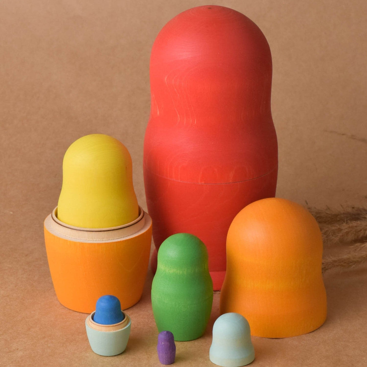Bright rainbow wooden matryoshka nesting dolls