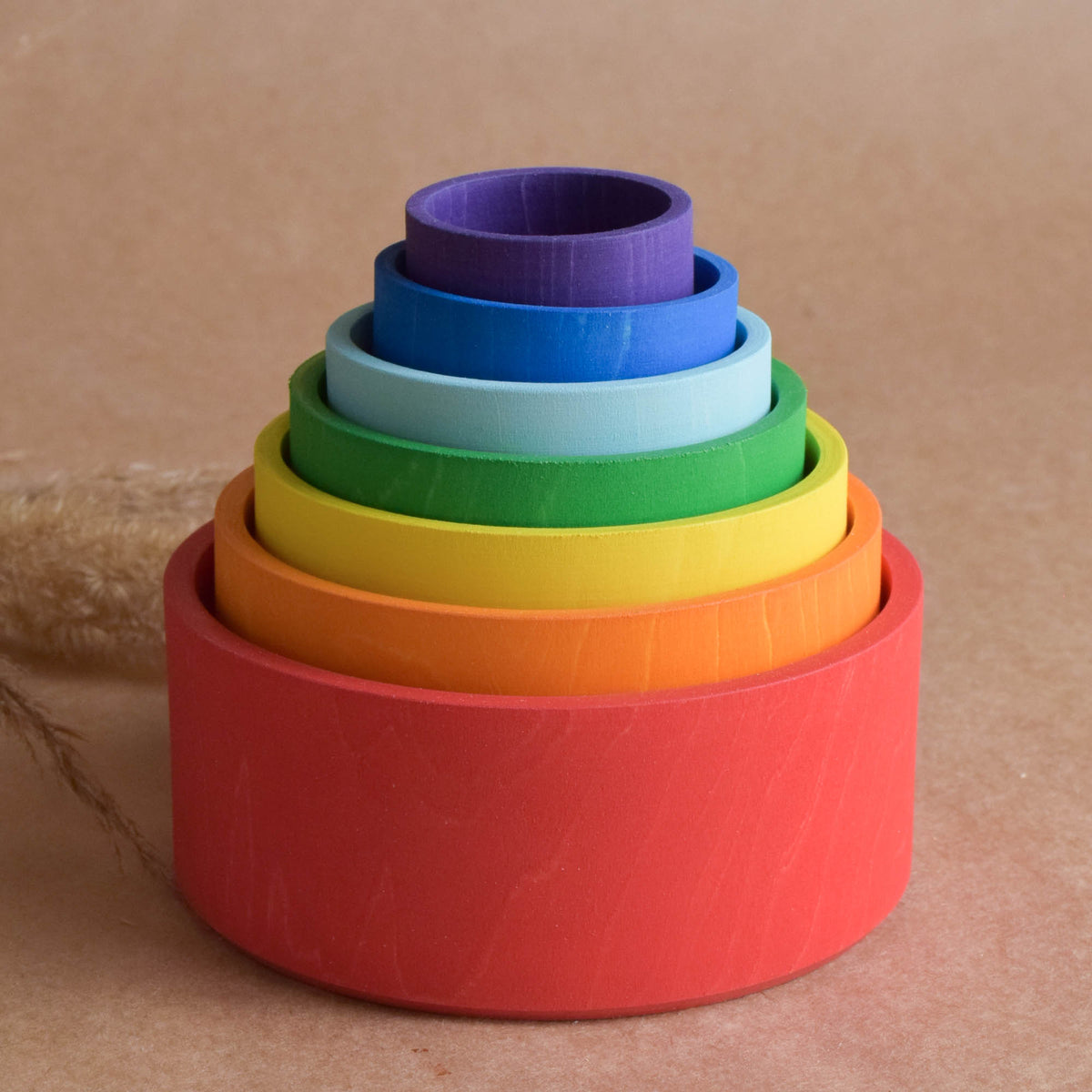Wooden nesting bowls in rainbow colors