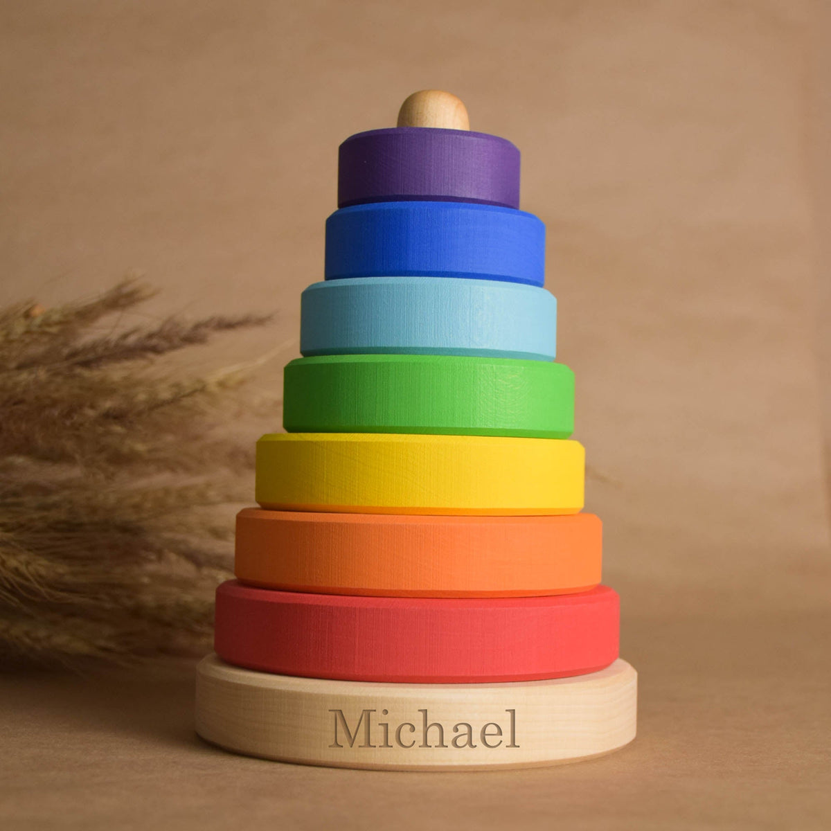 Wooden stacking rings toy with rainbow-colored rings