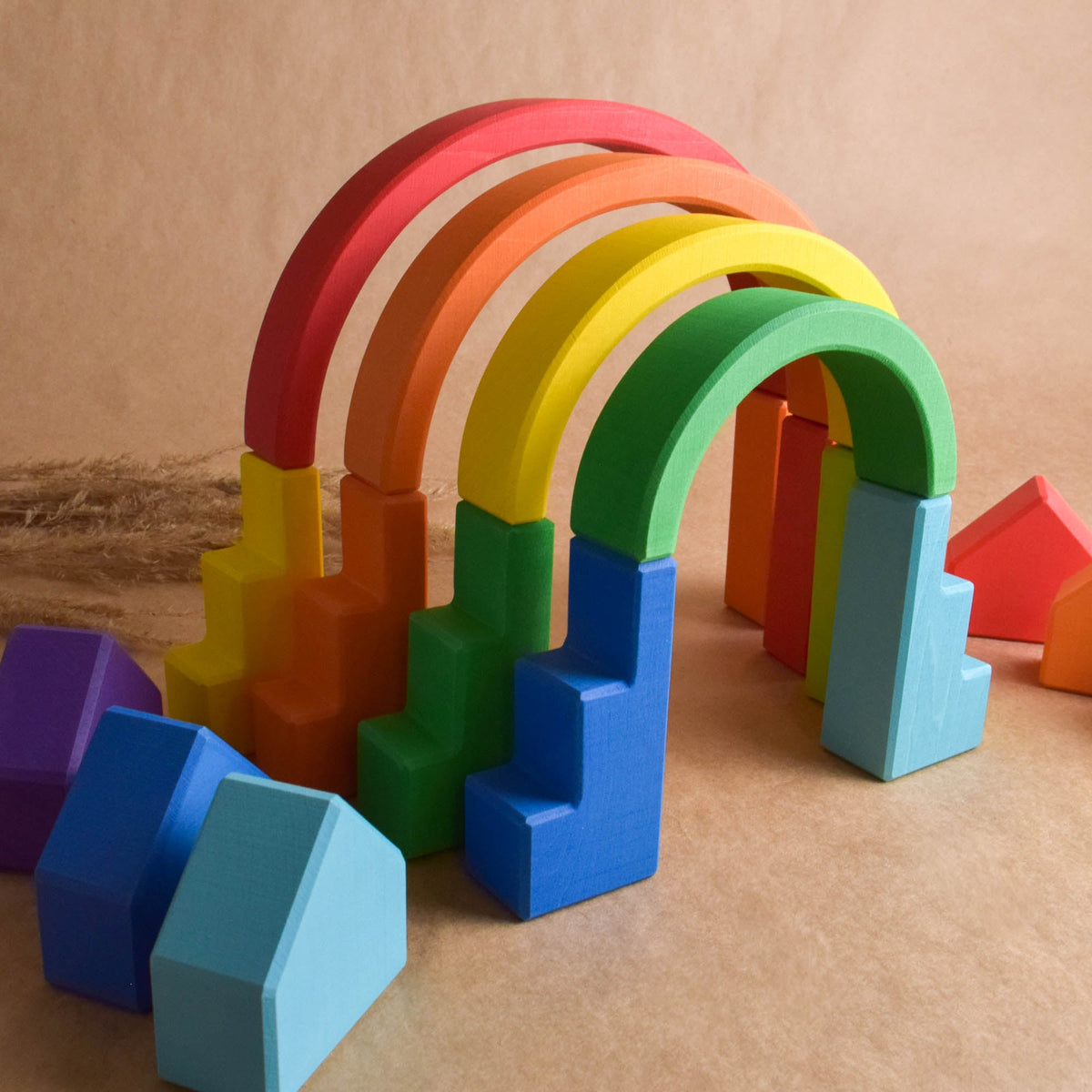 Rainbow Romanesque Building Set featuring colorful city-building wooden pieces for stacking, arranging, and building.