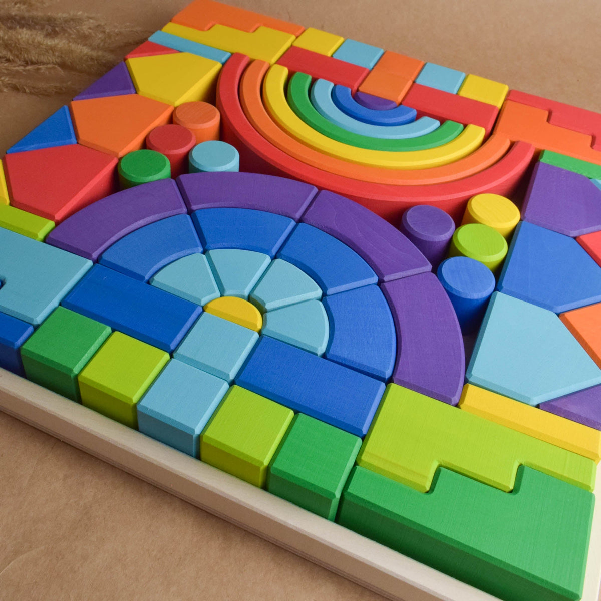 Product photo of Rainbow Romanesque Building Set, a colorful city-building wooden wooden rainbow stacker set.